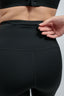 womens eco-friendly black compression performance leggings with hidden zipper pocket