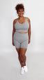 Grey non-toxic activewear yoga yet of bike shorts and longline sports bra