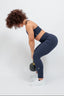 sustainable women's activewear blue high-waist leggings and adjustable sports bra for gym workouts