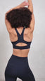 navy blue women's sportswear performance leggings and high support sports bra